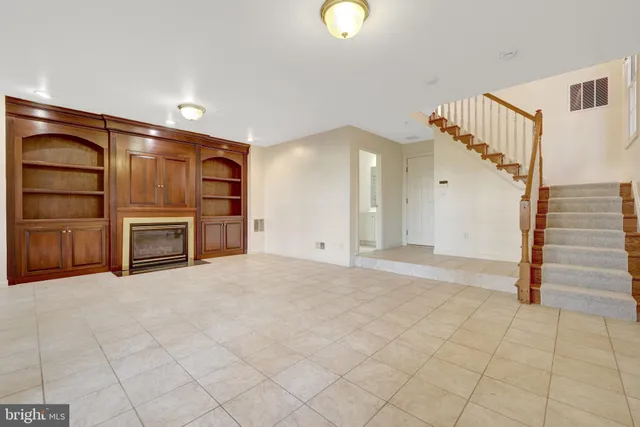 a view of backyard with wooden fence and trees