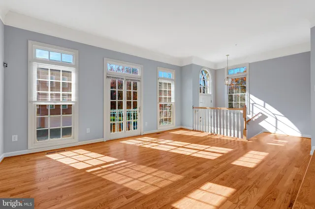 a view of an entryway with wooden floor