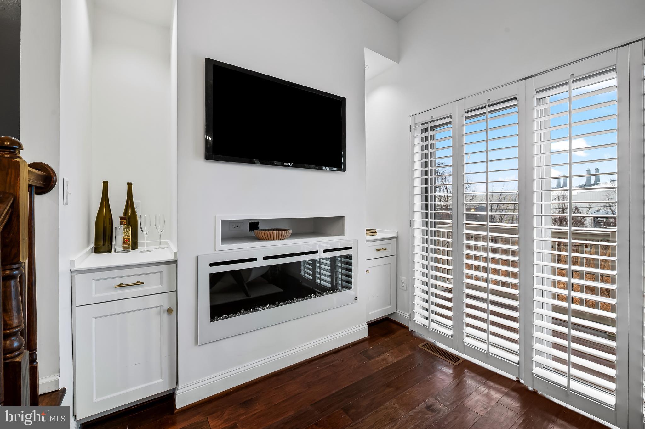 1602 Rampart Mews Baltimore, MD 21230 - Photo 11 of 49 fireplace with built ins