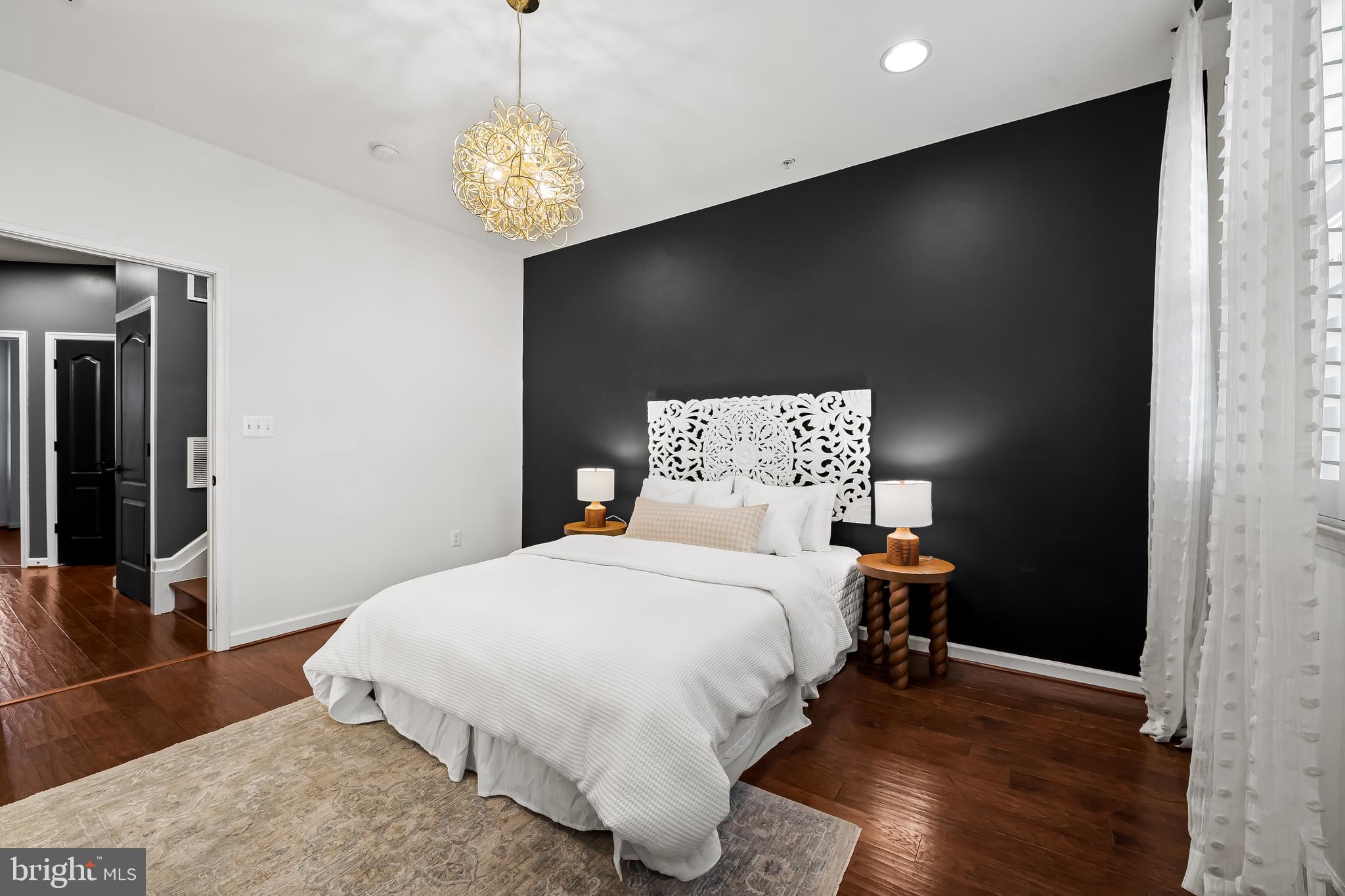 1602 Rampart Mews Baltimore, MD 21230 - Photo 23 of 49 primary bedroom with ensuite and water views