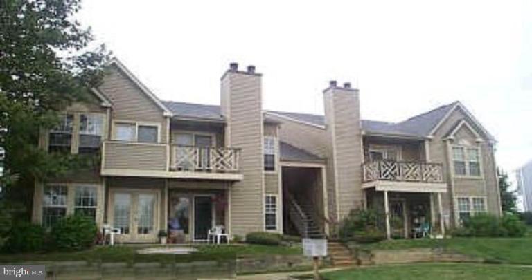 6460 Greenfield Road, Unit 205 Elkridge, MD 21075 - Photo 1 of 1 a front view of a building with garden