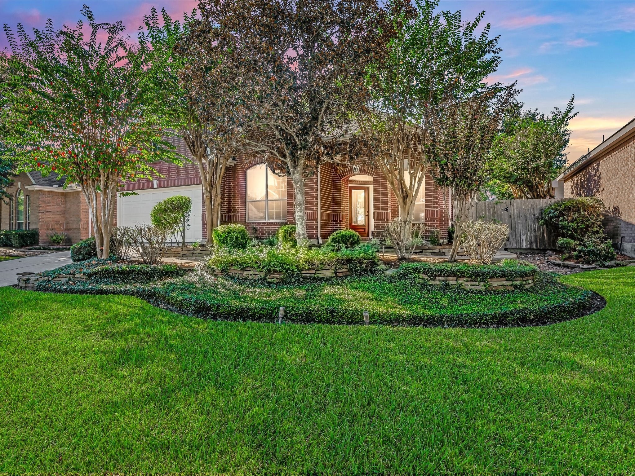 31 Tarrytown Way Conroe, TX 77384 - Photo 1 of 41 a front view of a house with garden