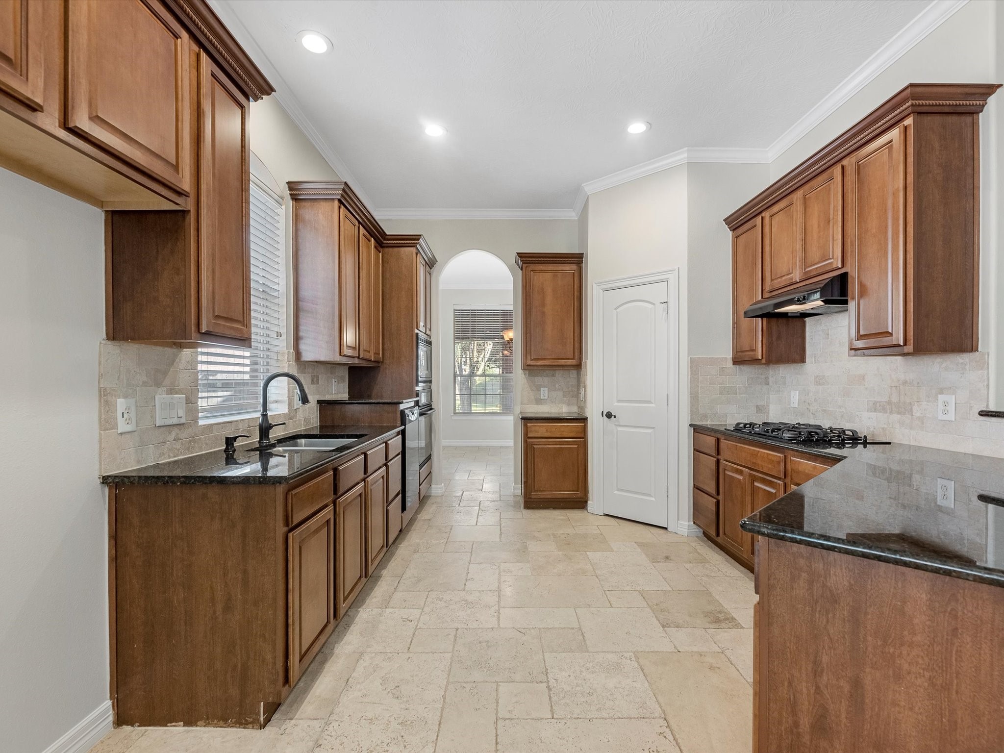 31 Tarrytown Way Conroe, TX 77384 - Photo 13 of 41 a large kitchen with stainless steel appliances granite countertop a stove a sink dishwasher and a refrigerator