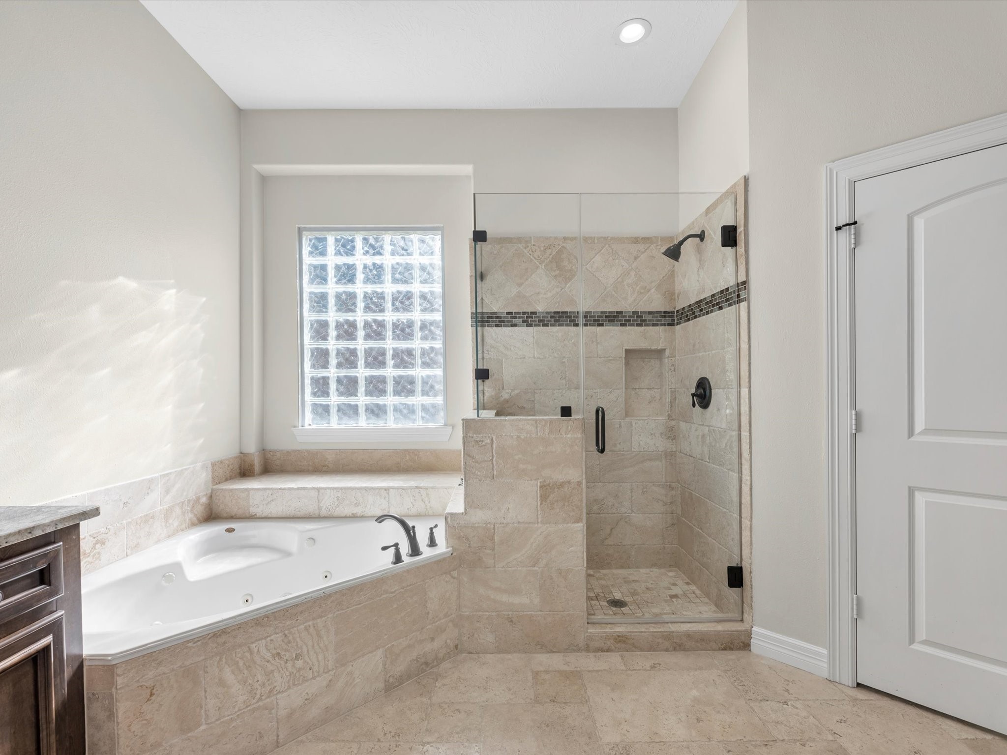 31 Tarrytown Way Conroe, TX 77384 - Photo 22 of 41 a bathroom with a bathtub and a shower