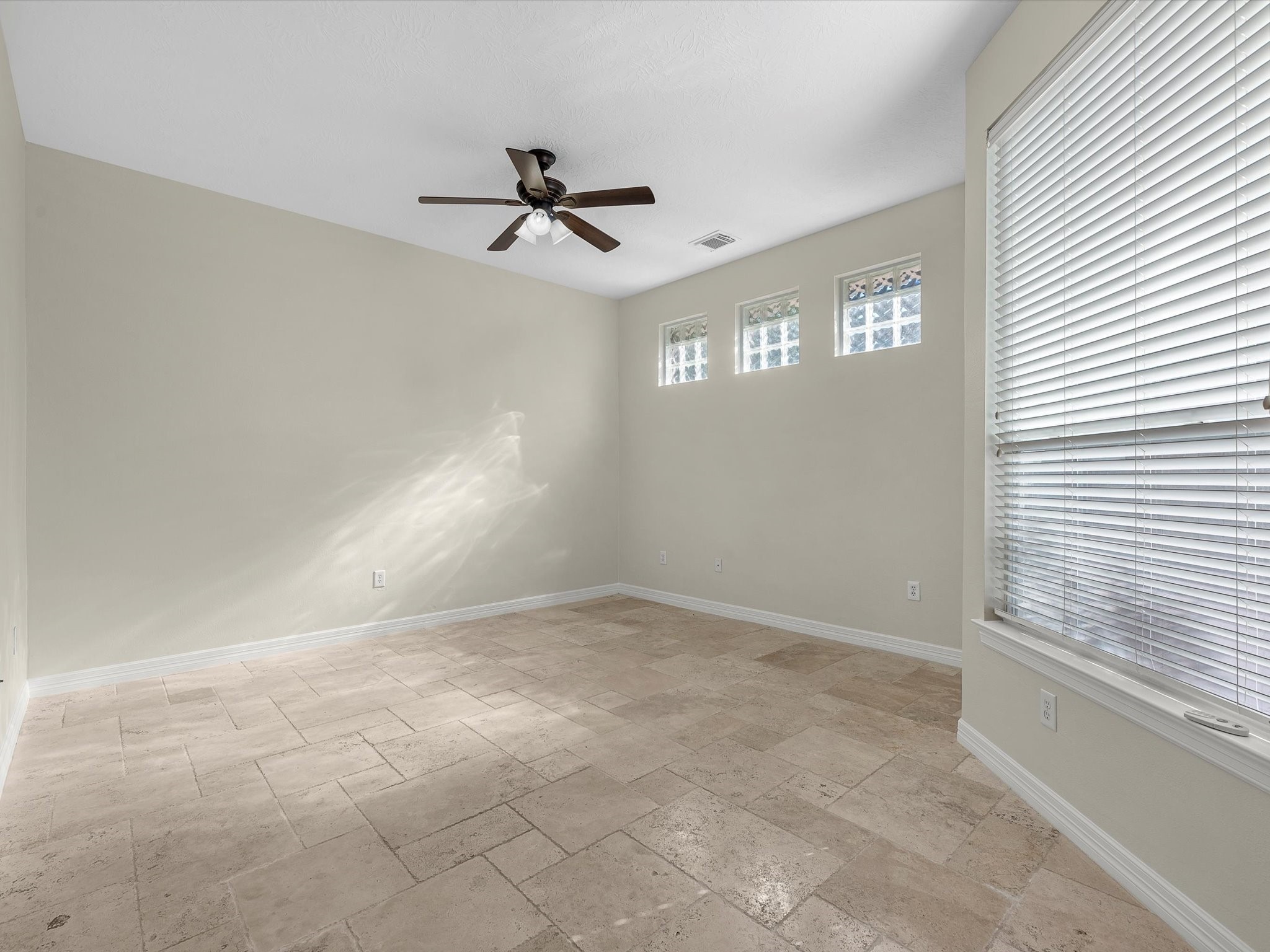 31 Tarrytown Way Conroe, TX 77384 - Photo 23 of 41 an empty room with windows and fan