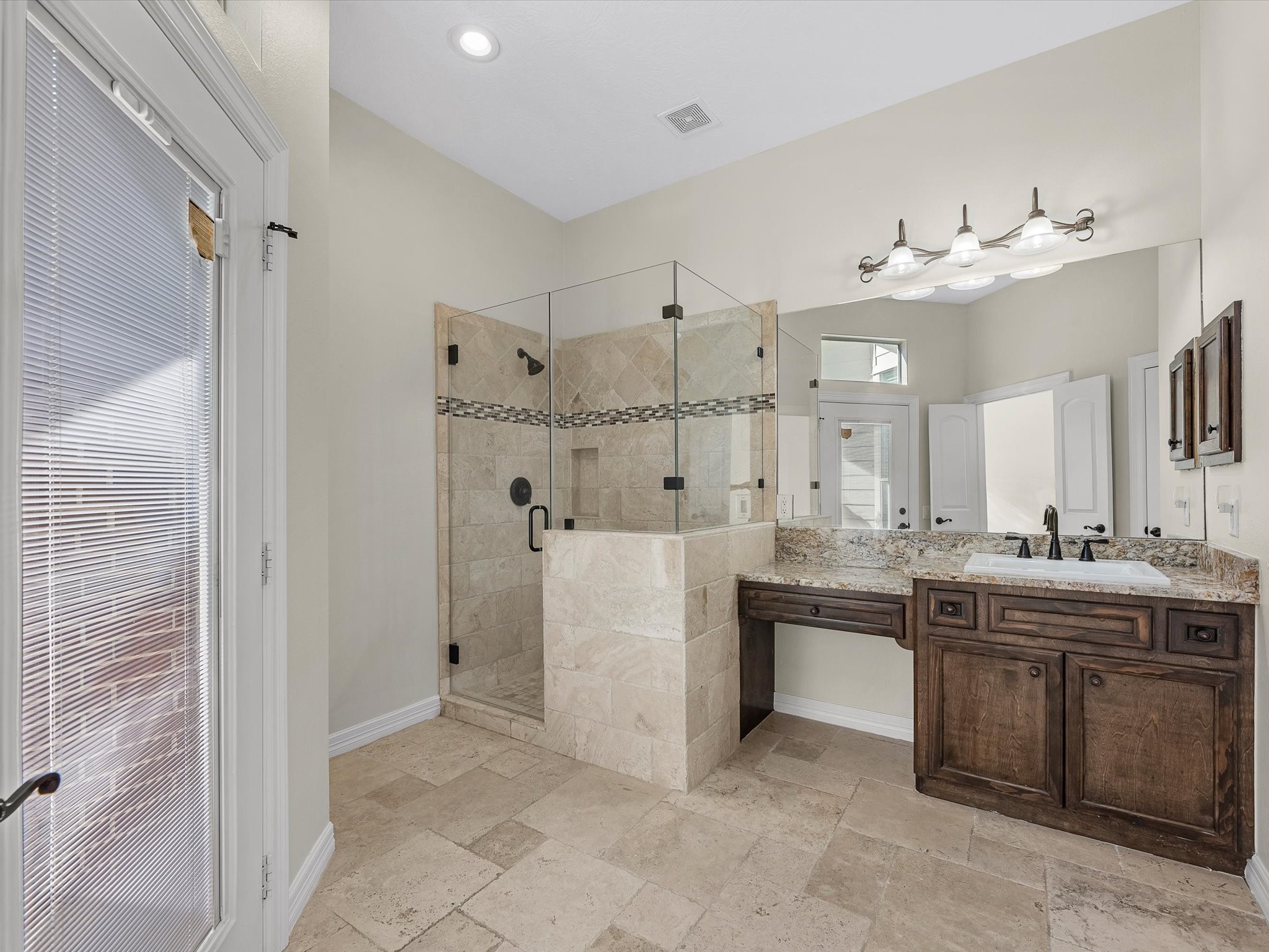 31 Tarrytown Way Conroe, TX 77384 - Photo 24 of 41 a bathroom with a double vanity sink mirror and shower