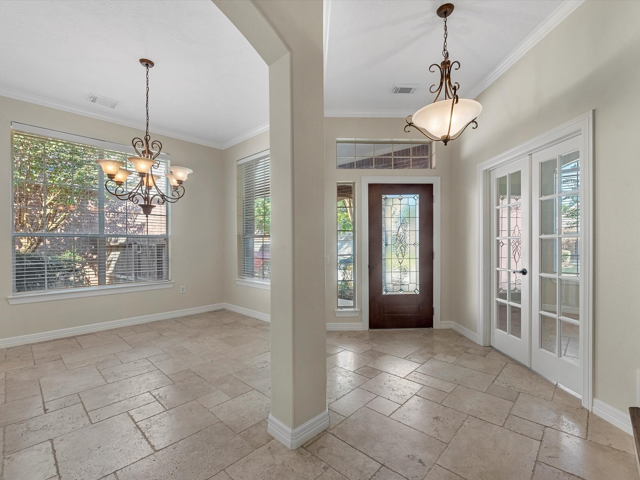 31 Tarrytown Way Conroe, TX 77384 - Photo 5 of 41 a view of a room with windows and chandelier