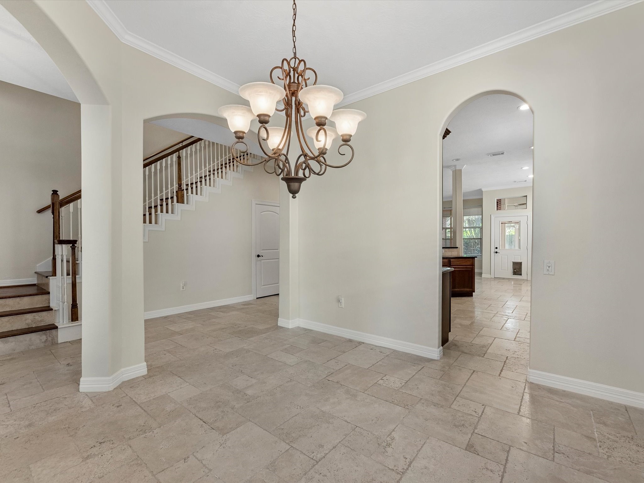 31 Tarrytown Way Conroe, TX 77384 - Photo 7 of 41 an empty room that has a chandelier and wooden floor
