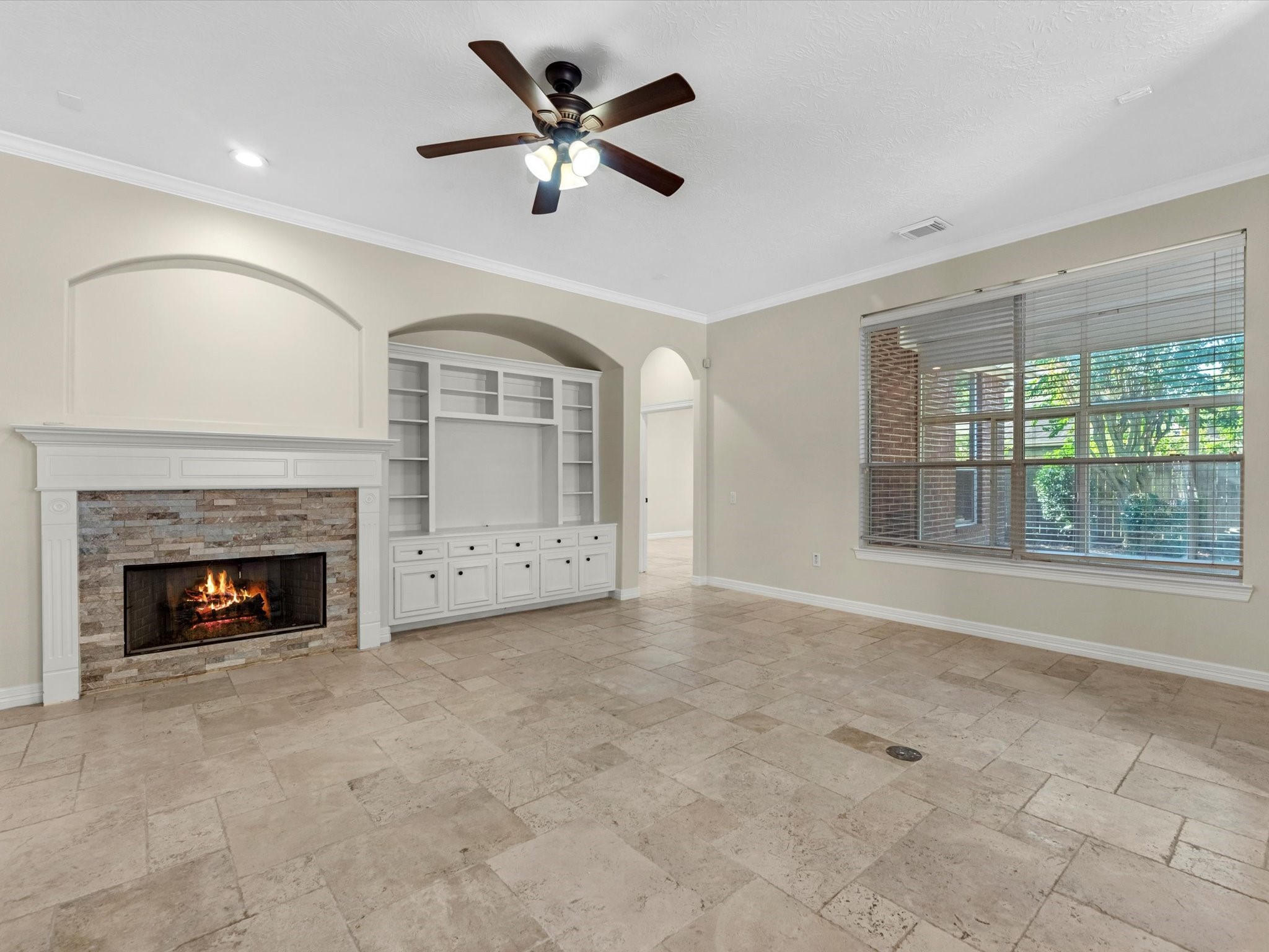 31 Tarrytown Way Conroe, TX 77384 - Photo 9 of 41 an empty room with fireplace and windows