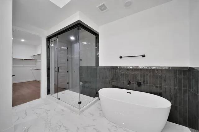 a bathroom with a bathtub and a sink