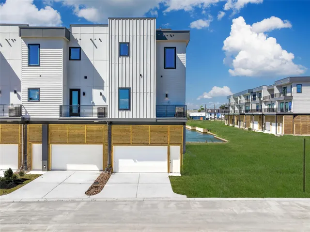 a view of a house with swimming pool and sitting area