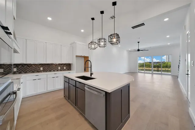 a kitchen with a stove and a sink
