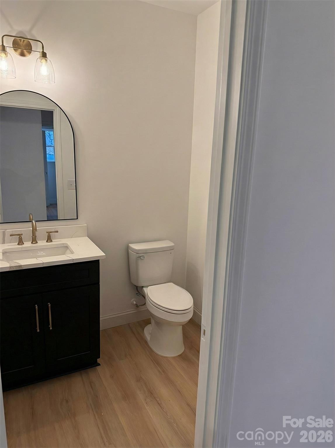 2170 Neel Road Salisbury, NC 28147 - Photo 12 of 21 a bathroom with a sink vanity mirror and toilet