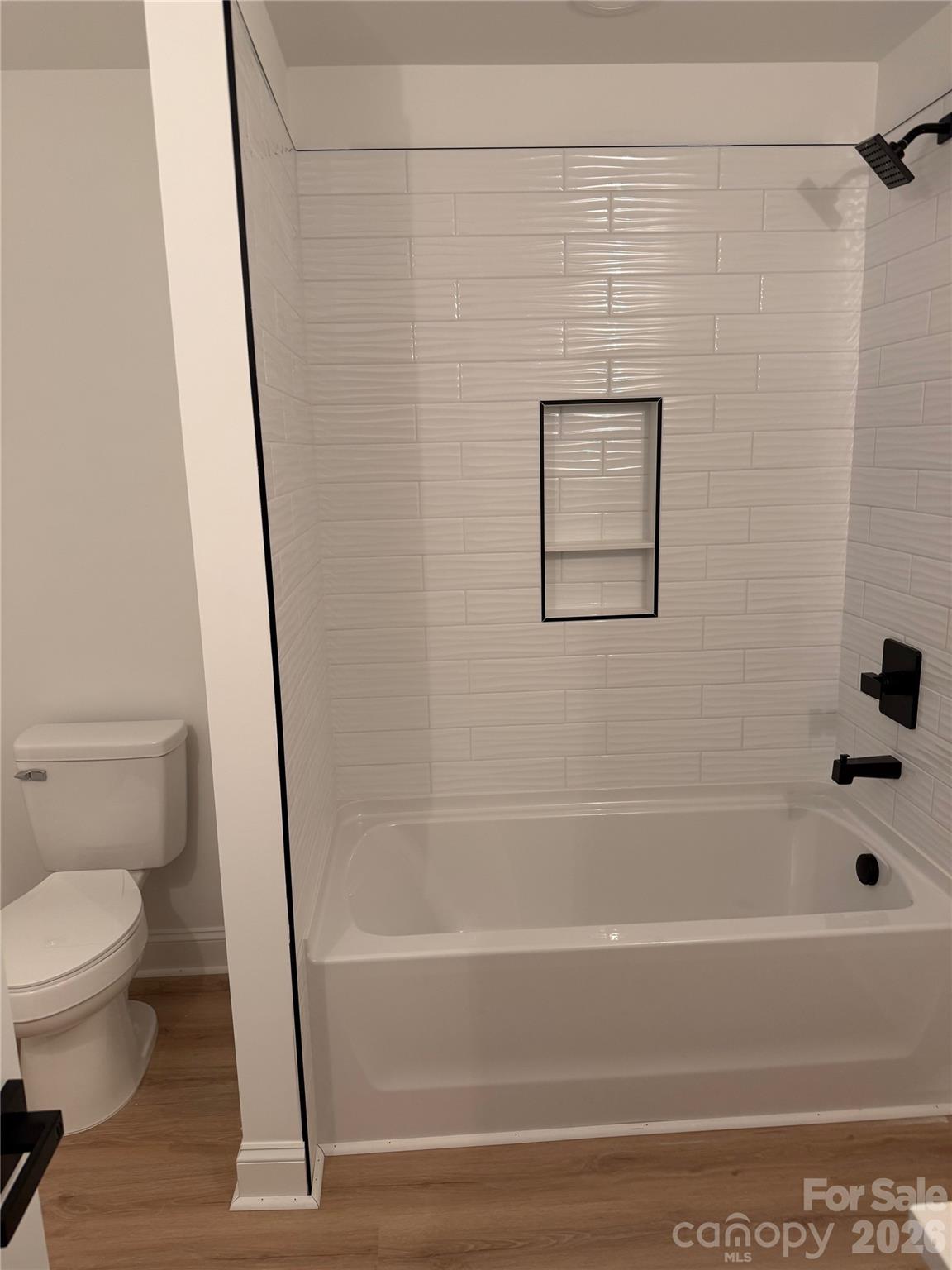 2170 Neel Road Salisbury, NC 28147 - Photo 14 of 21 a bathroom with a toilet and a bathtub