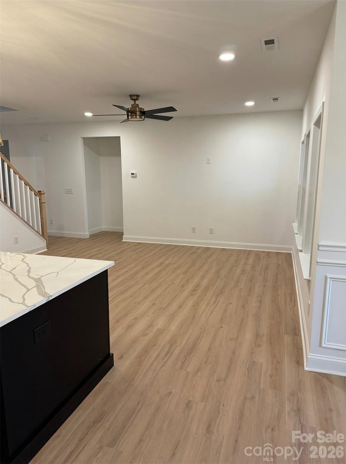 2170 Neel Road Salisbury, NC 28147 - Photo 6 of 21 an empty room with wooden floor and entrance