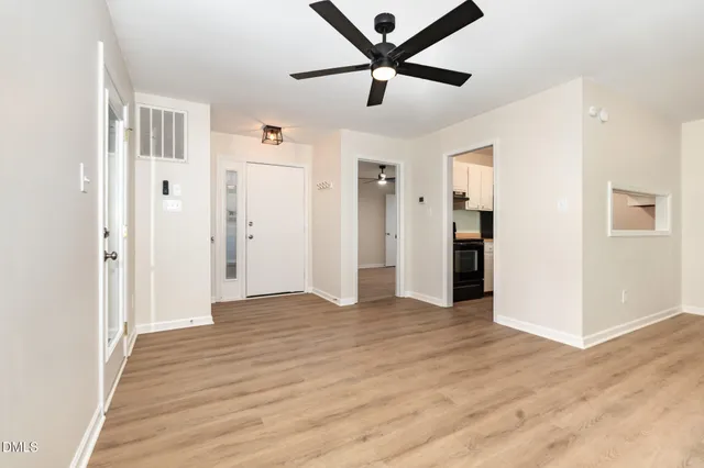 a kitchen with a sink stove top oven and cabinets