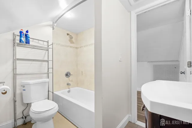a bathroom with a sink toilet and a bathtub