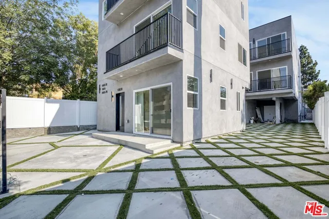 a view of a palm trees in front of a building
