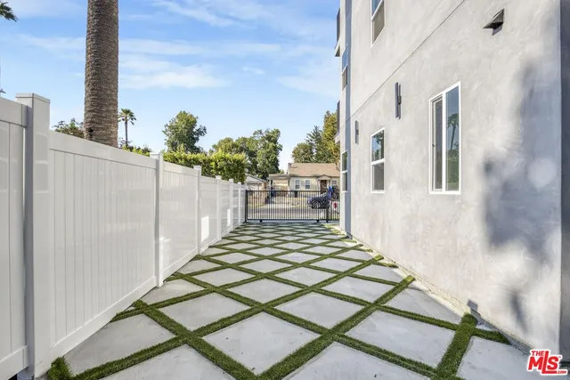 a kitchen with stainless steel appliances granite countertop a sink stove and microwave