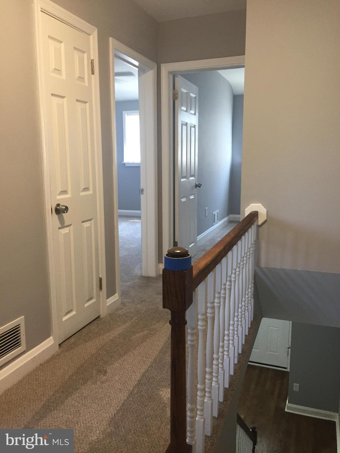 1928 Jasmine Road Dundalk, MD 21222 - Photo 10 of 30 a view of a hallway with wooden floor and staircase