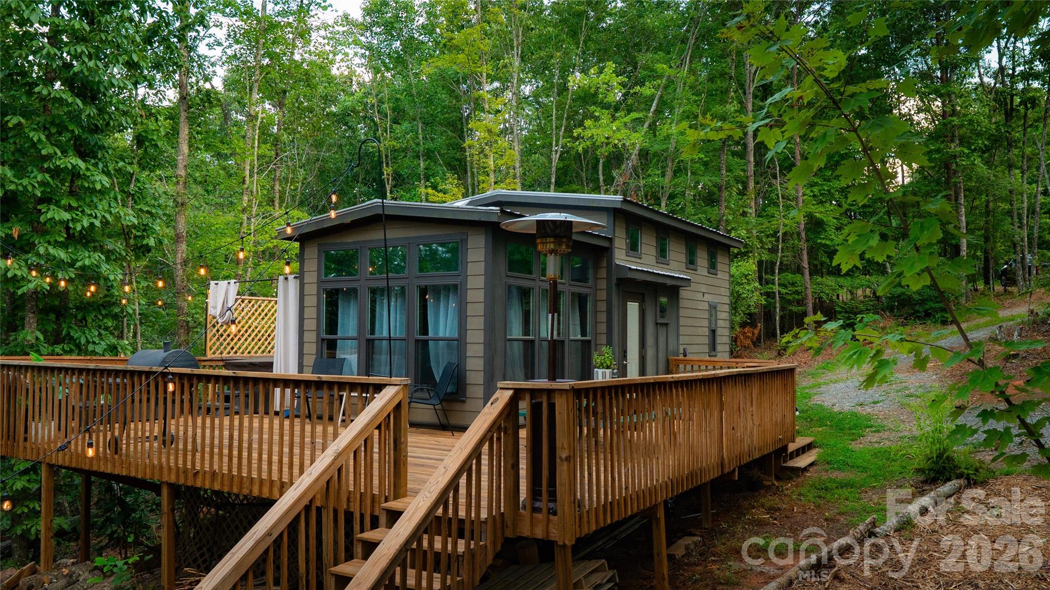 221 Summerfield Lane Rutherfordton, NC 28139 - Photo 21 of 33 a view of a roof deck with chair and wooden floor