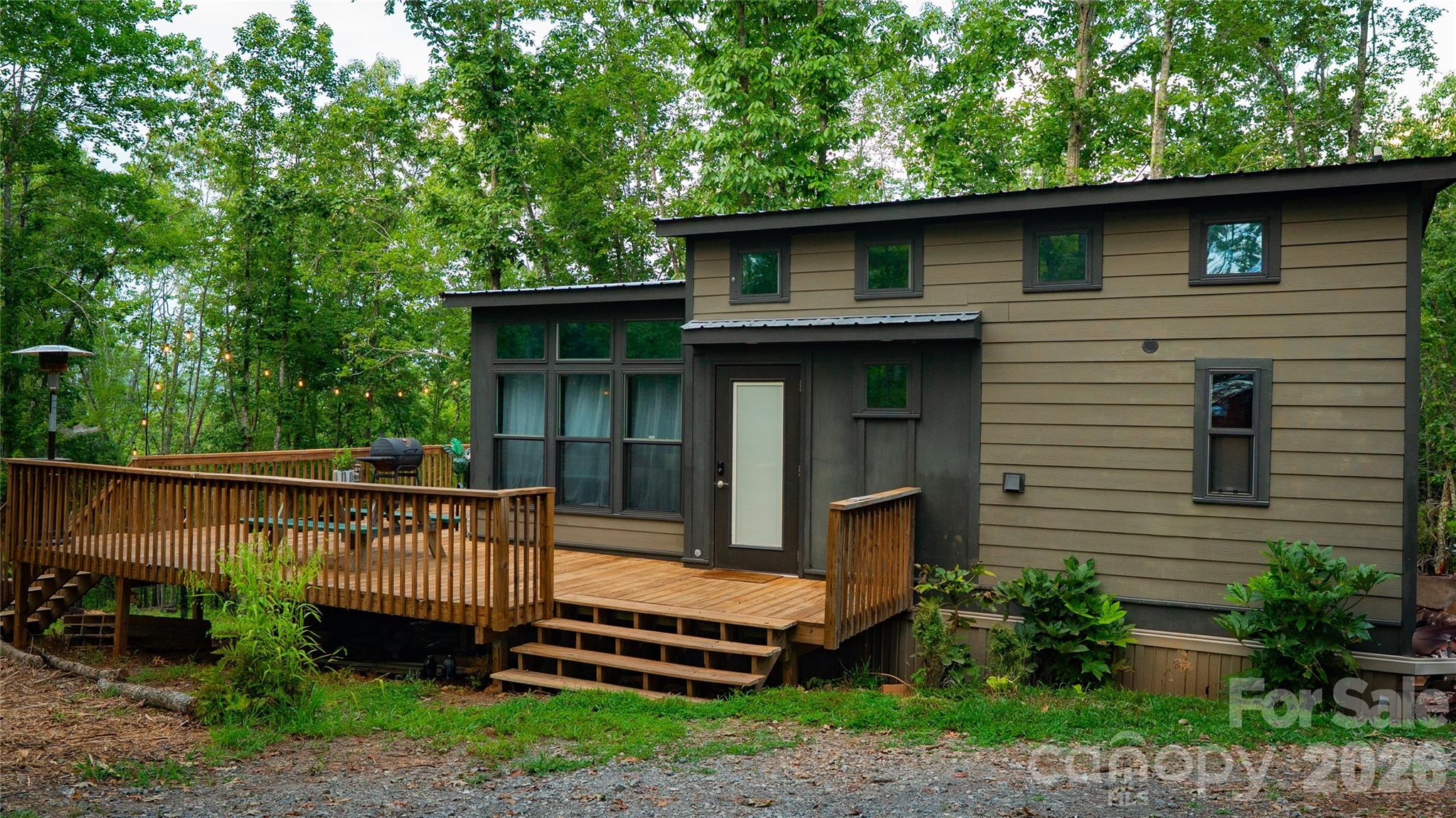 221 Summerfield Lane Rutherfordton, NC 28139 - Photo 25 of 33 a view of a deck with a table and chairs under an umbrella