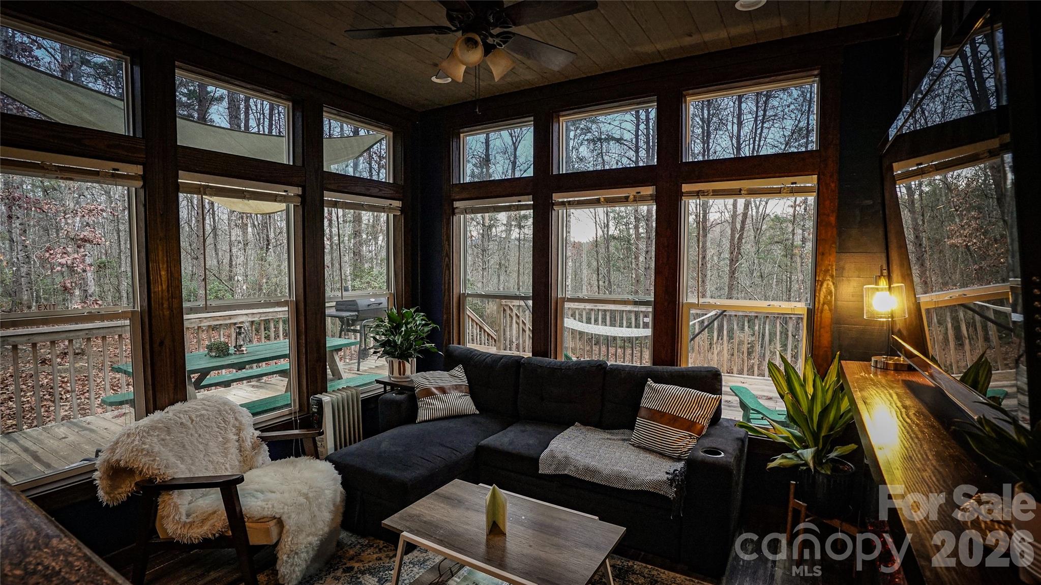 221 Summerfield Lane Rutherfordton, NC 28139 - Photo 4 of 33 a living room with furniture and a floor to ceiling window