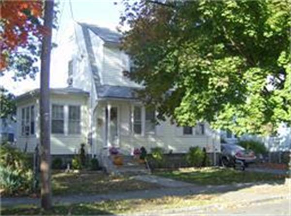 166 Eddy Street Springfield, MA 01104 - Photo 1 of 7 a front view of a house with a yard