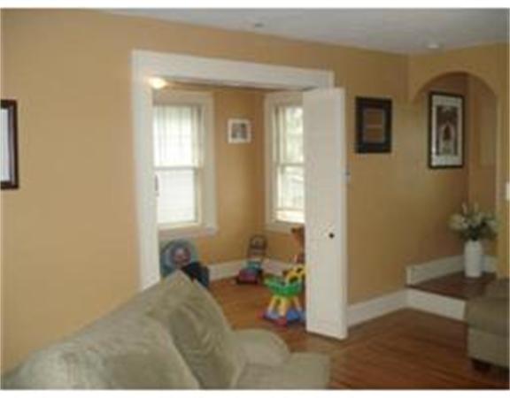 166 Eddy Street Springfield, MA 01104 - Photo 3 of 7 a bedroom with a bed and a window