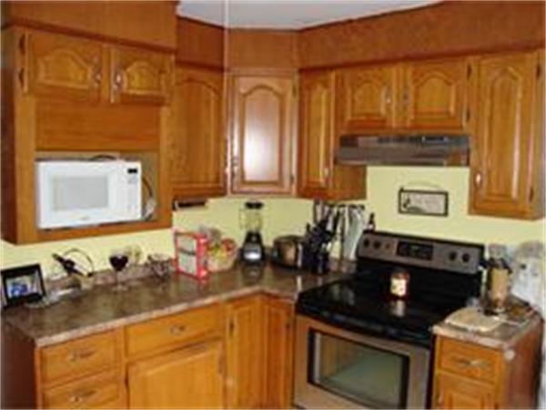 166 Eddy Street Springfield, MA 01104 - Photo 5 of 7 a kitchen with stainless steel appliances a stove and a microwave