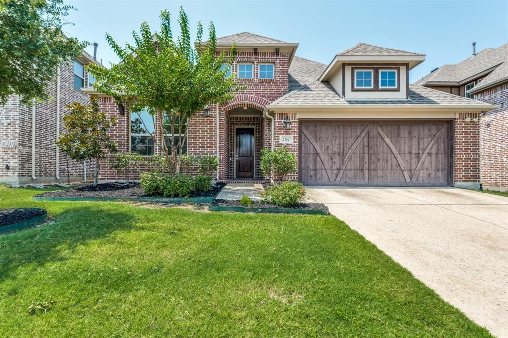 2364 Mare Road Carrollton, TX 75010 - Photo 1 of 25 a front view of a house with garden