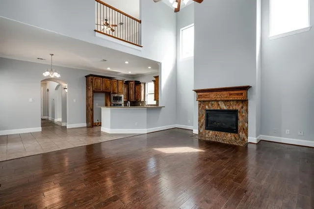 an entryway with fireplace and wooden floor