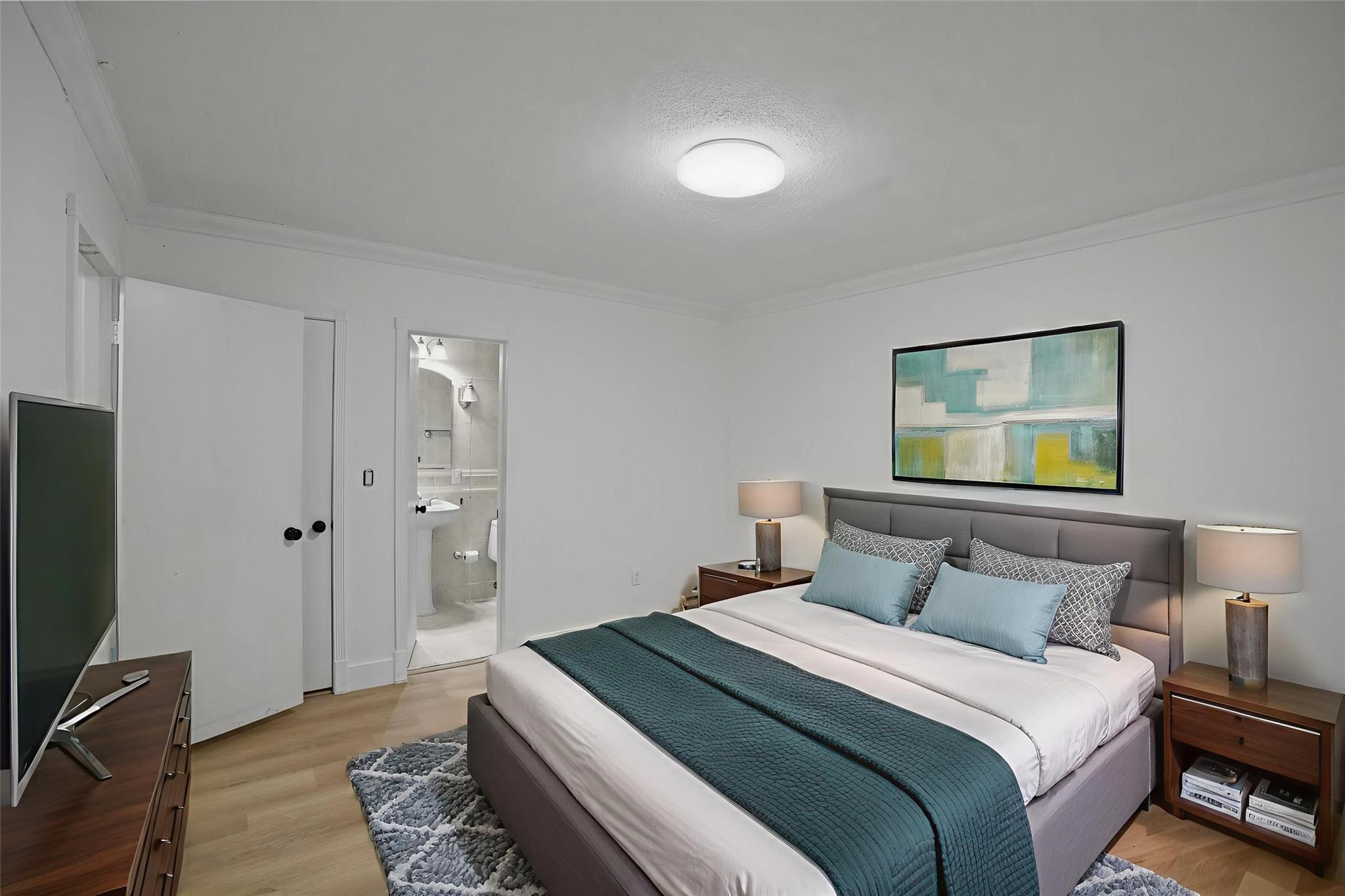 8930 Southwest 38th Street Miami, FL 33165 - Photo 11 of 16 a bedroom with a bed and a flat screen tv