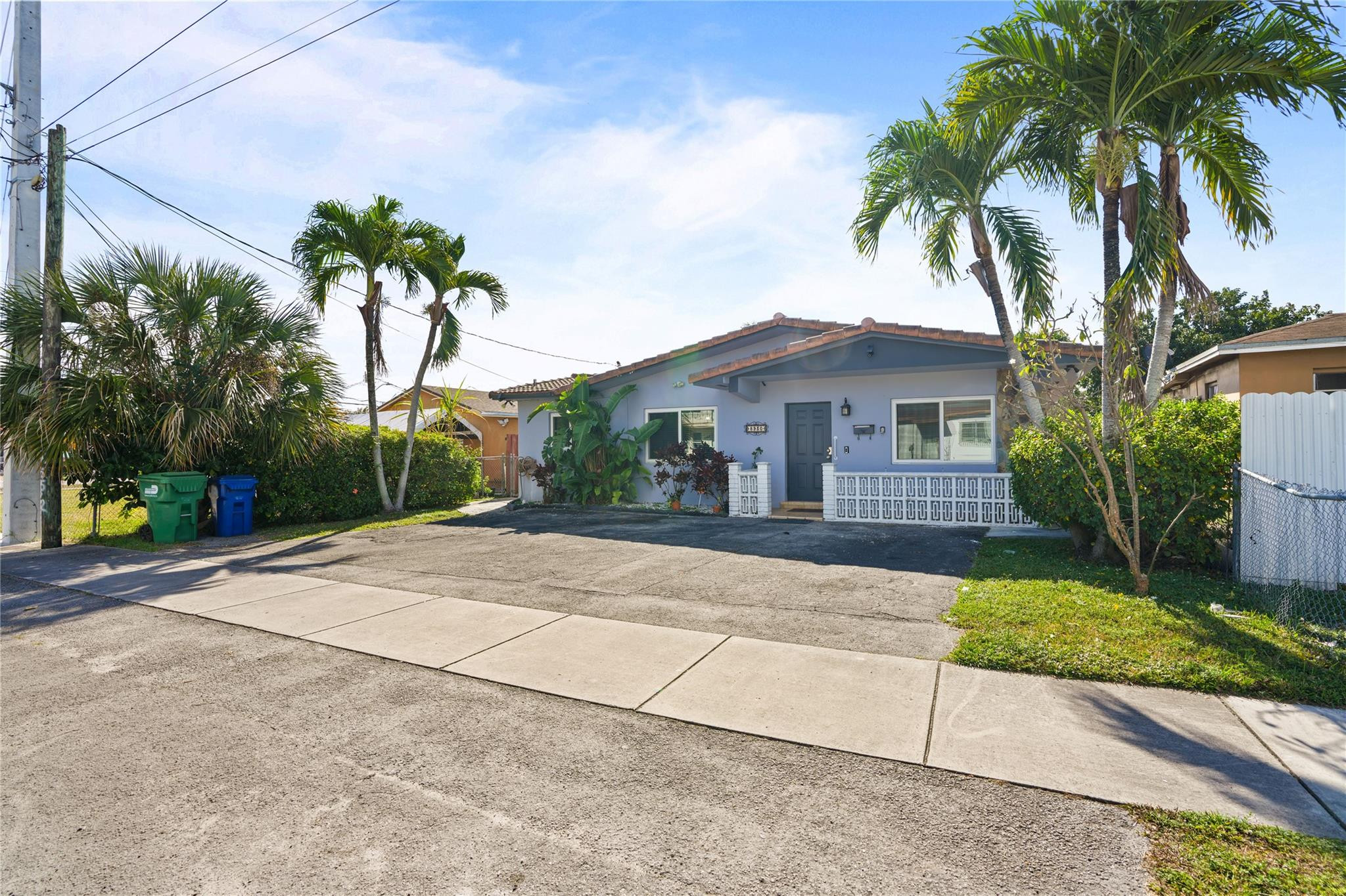 8930 Southwest 38th Street Miami, FL 33165 - Photo 16 of 16 a house with palm tree in front of it