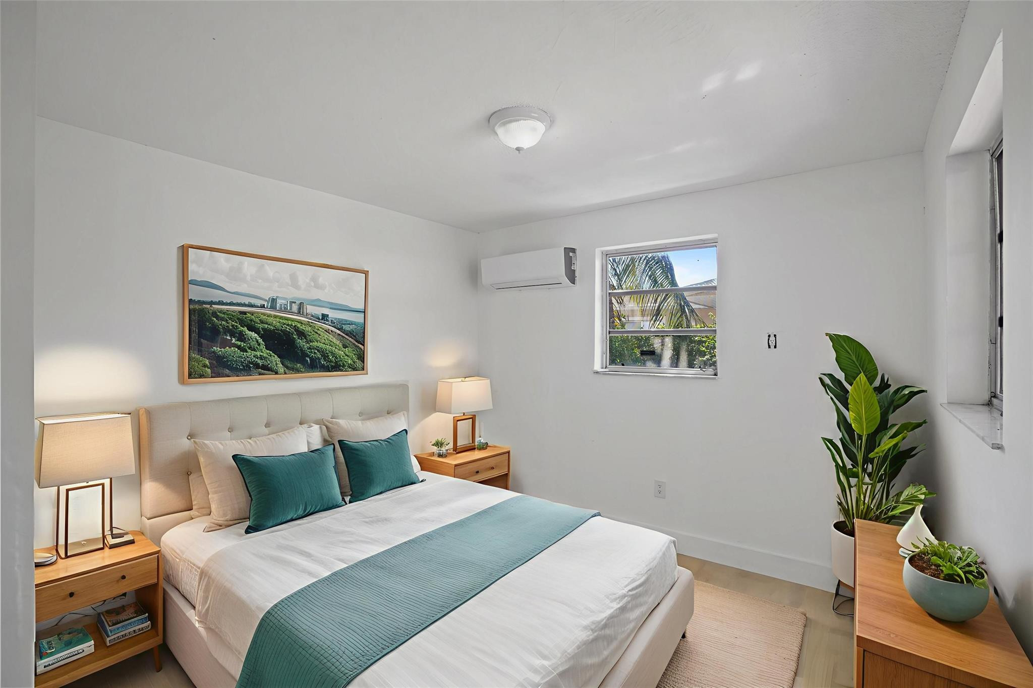 8930 Southwest 38th Street Miami, FL 33165 - Photo 8 of 16 a bedroom with a bed and a painting on the wall