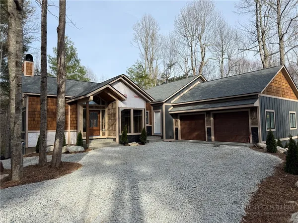 a view of a car park in front of house