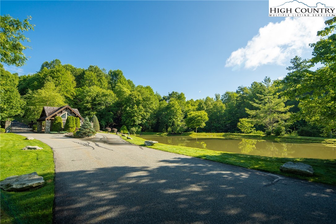 Boulder Creek Drive Boone, NC 28607 - Photo 11 of 25 a view of a swimming pool with an outdoor space and seating area