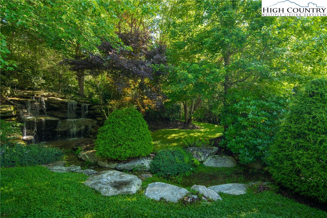 Boulder Creek Drive Boone, NC 28607 - Photo 16 of 25 a backyard of a house with lots of green space