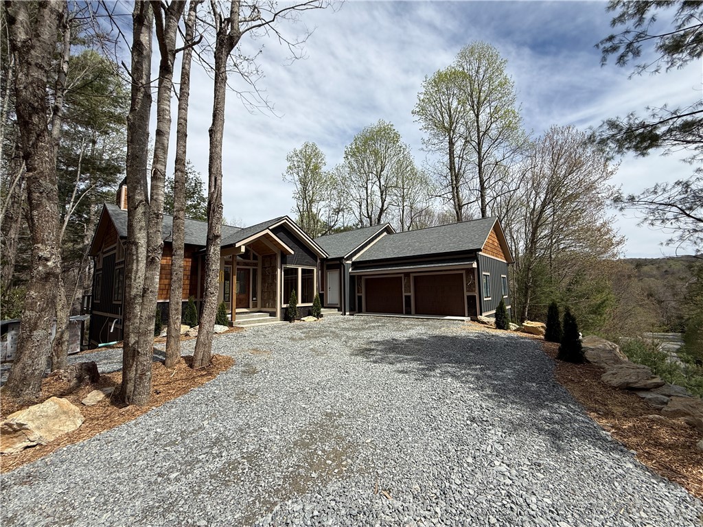 Boulder Creek Drive Boone, NC 28607 - Photo 2 of 32 a front view of a house with a yard and garage