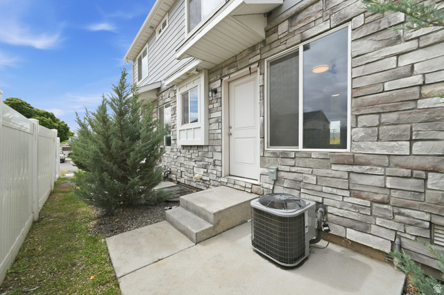 295 Spruce Way Santaquin, UT 84655 - Photo 26 of 32 Stone veneer and siding exterior with concrete patio