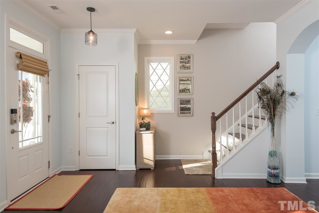 1520 Crafton Way Raleigh, NC 27607 - Photo 3 of 22 a view of entryway with wooden floor