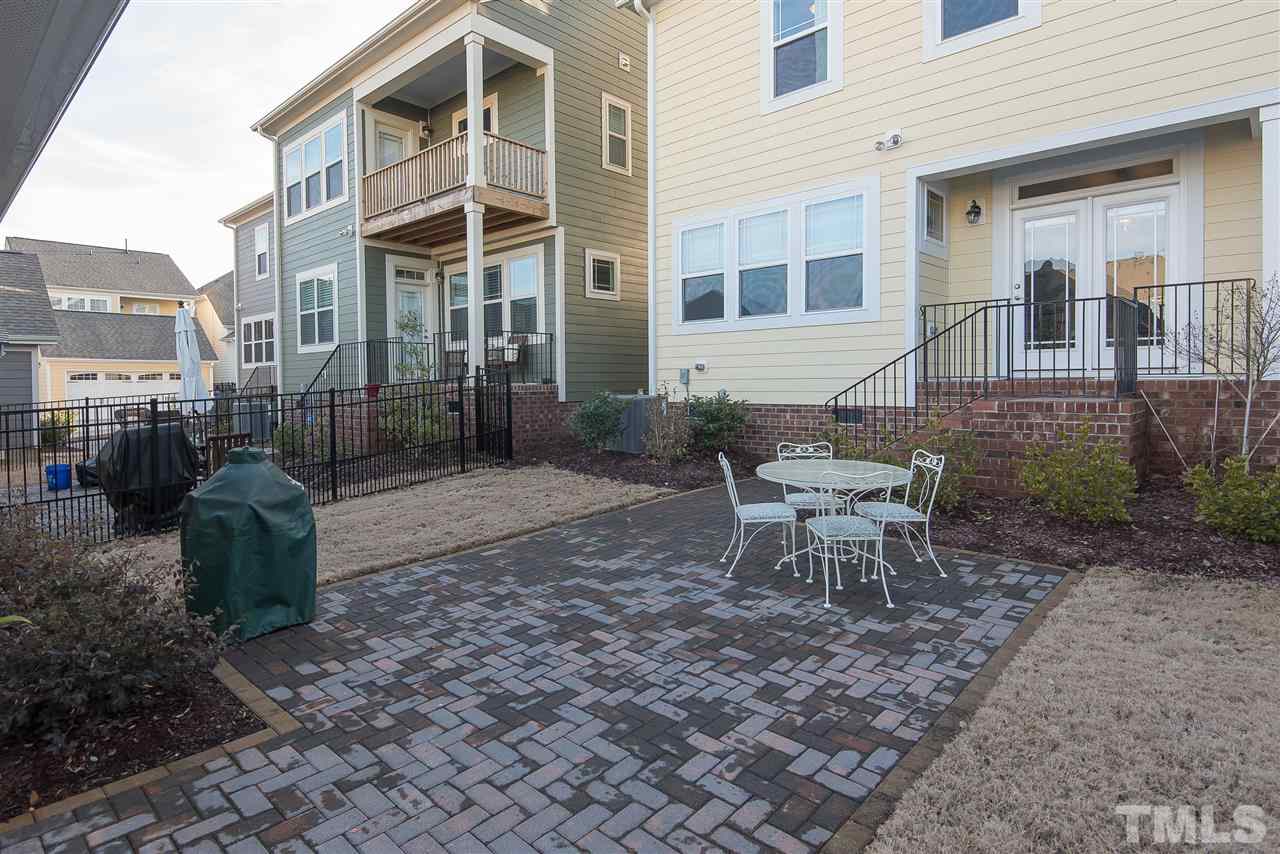 1520 Crafton Way Raleigh, NC 27607 - Photo 22 of 22 a wooden bench sitting in front of a building