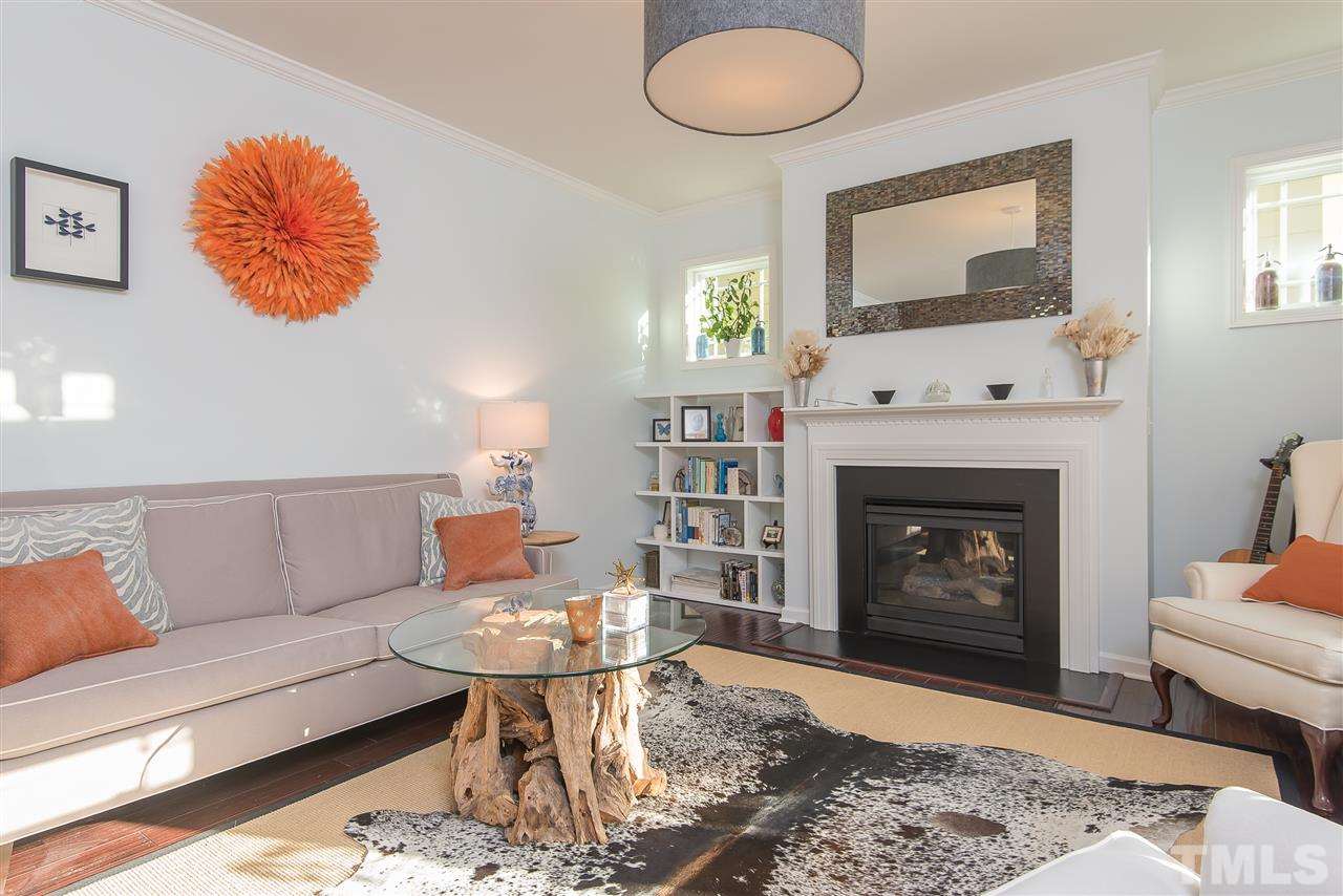 1520 Crafton Way Raleigh, NC 27607 - Photo 4 of 22 a living room with furniture and a fireplace