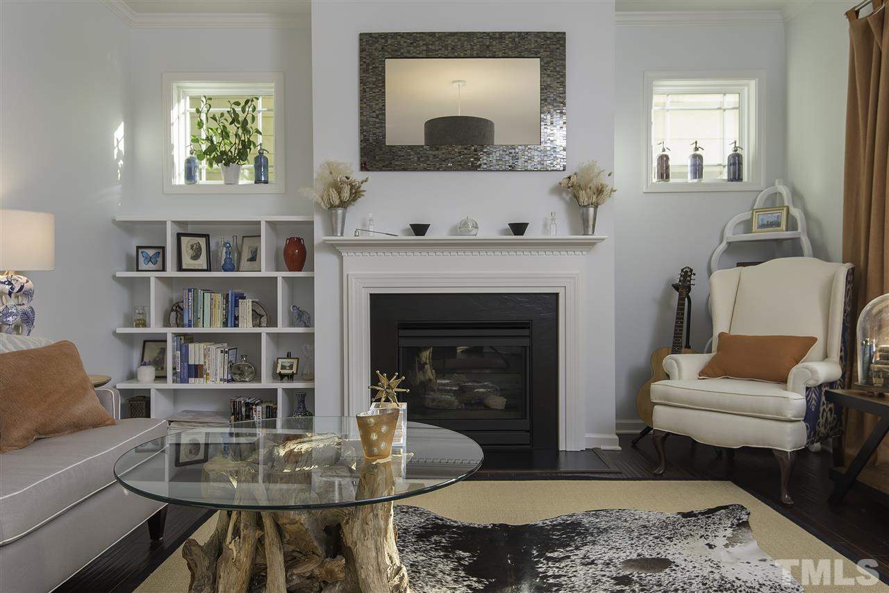 1520 Crafton Way Raleigh, NC 27607 - Photo 5 of 22 a living room with furniture and a fireplace