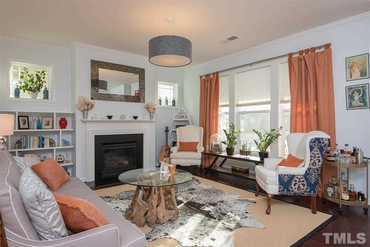 1520 Crafton Way Raleigh, NC 27607 - Photo 6 of 22 a living room with furniture large window and a fireplace