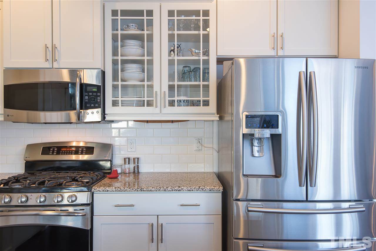 1520 Crafton Way Raleigh, NC 27607 - Photo 10 of 22 a kitchen with appliances and cabinets