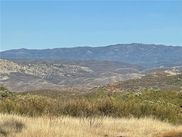 a view of ocean from a mountain