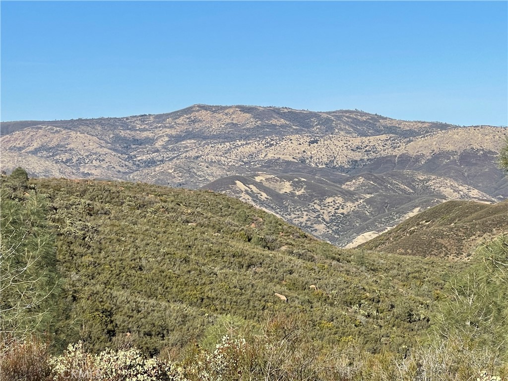 4747 Bear Valley Road Mariposa, CA 95338 - Photo 4 of 7 a view of a mountain range in a cloudy sky