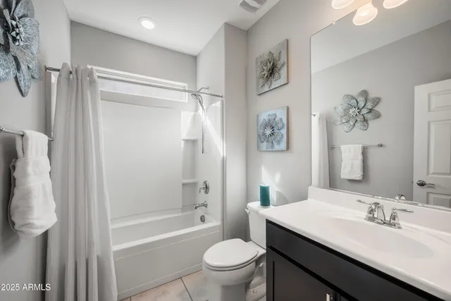 a bathroom with a sink toilet tub and shower