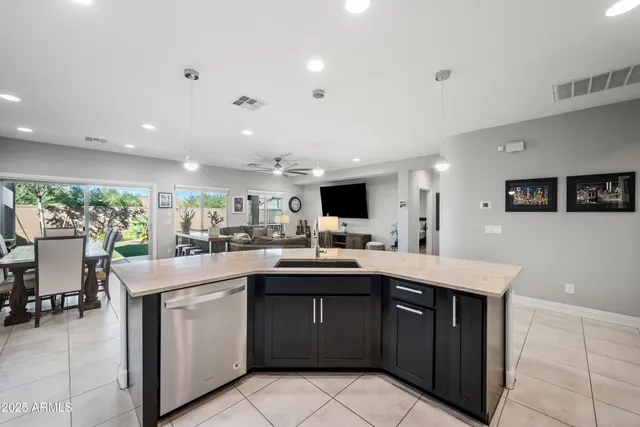 a kitchen with a sink and cabinets